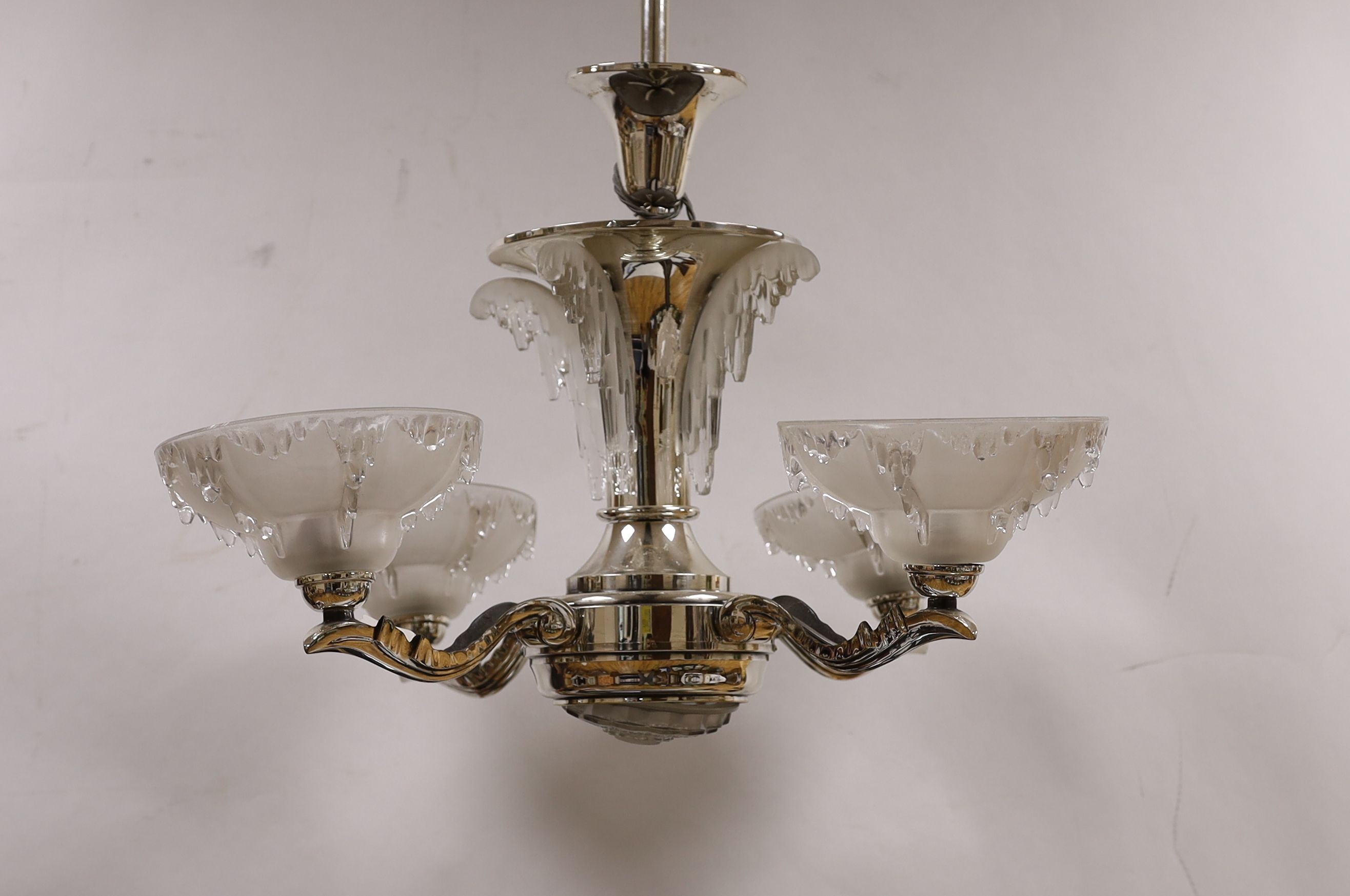 A chrome Art Deco 4 branch electrolier, with frosted glass shades, 77 cms high.